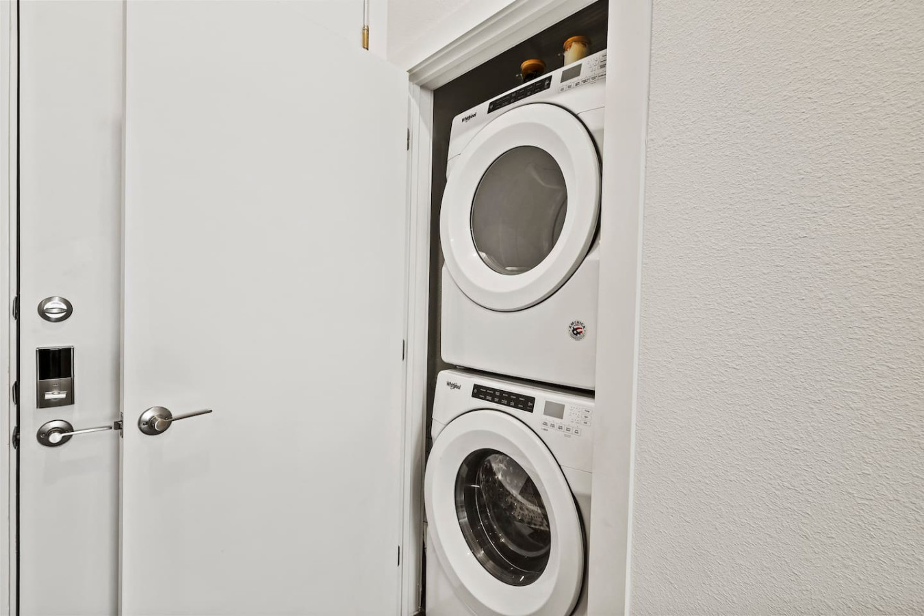 Laundry room with a washer, dryer, and folding area, offering all the convenience you need for a comfortable extended stay.