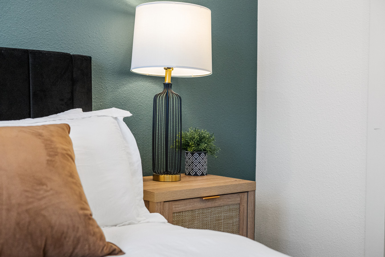 The bedroom’s serene ambiance invites you to relax, with a plush bed that promises a restful night's sleep.