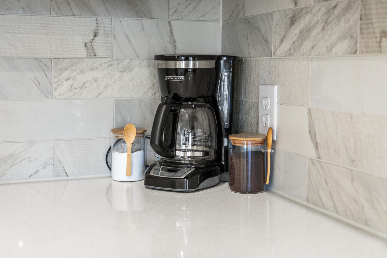 Start your mornings with fresh coffee—everything you need is ready on the countertop.