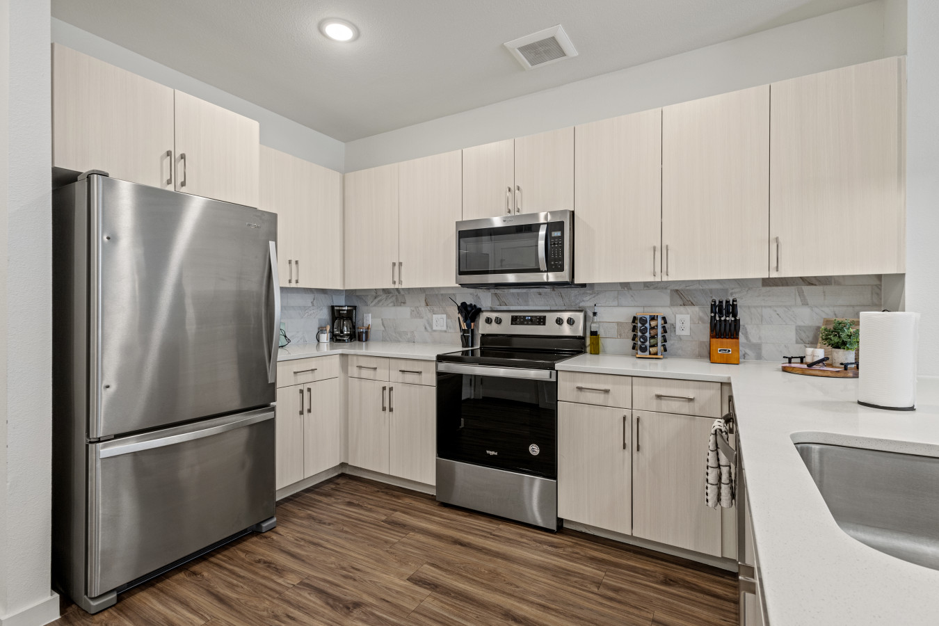 Cook with ease in our modern kitchen, featuring stainless steel appliances and all the essentials for a comfortable stay.