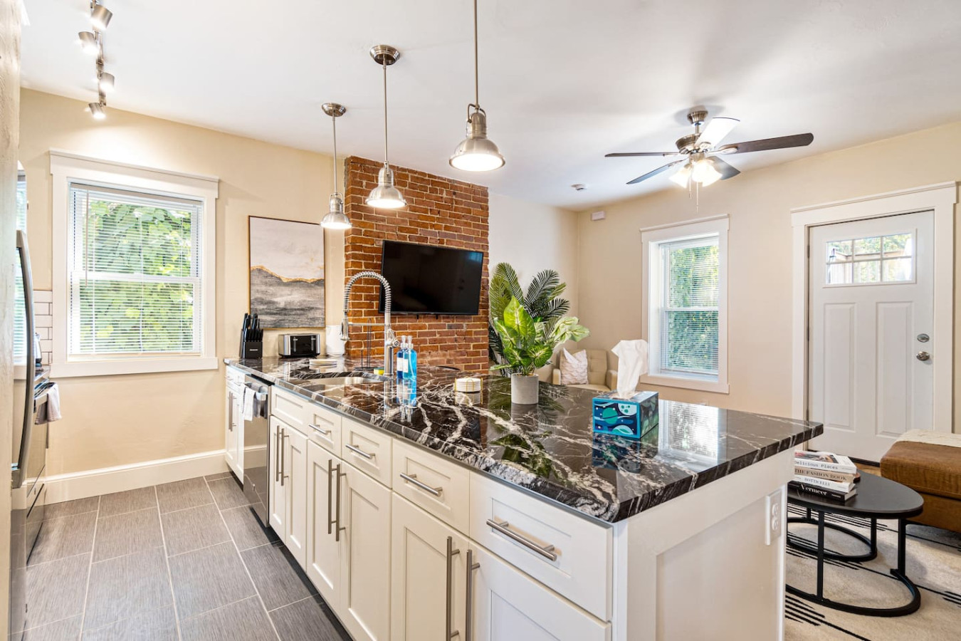 The kitchen’s open layout allows you to move freely as you prepare meals, with everything you need at your fingertips.
