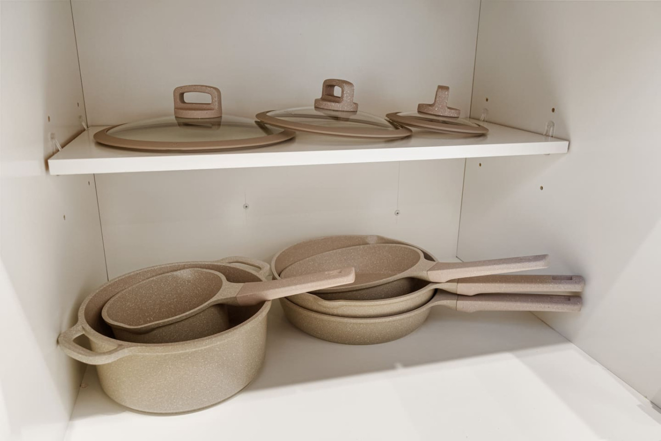 Kitchen cabinets stocked with cooking wares, glassware and silverwares, ideal for mixing up your favorite meals and drinks during your stay.