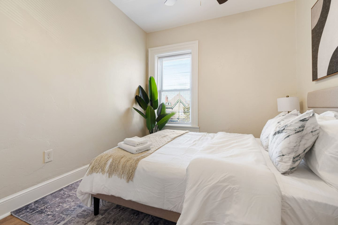 The bedroom offers a luxurious retreat, with a bed that promises restful nights and a room that feels like a private oasis.