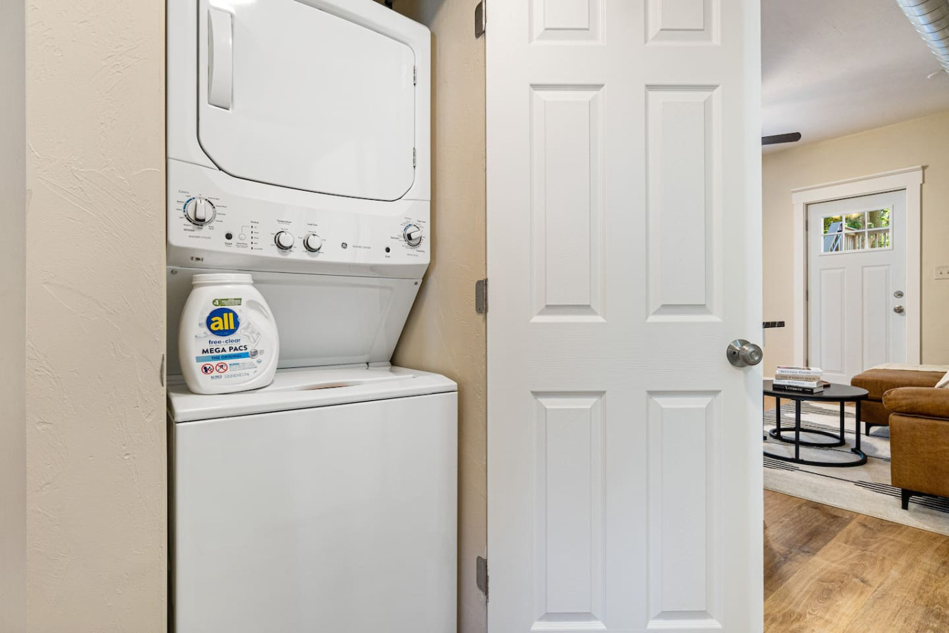 As you step into the laundry room, the modern appliances and ample storage space make it easy to keep things tidy.