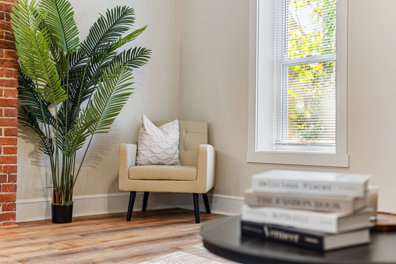 You feel a sense of peace as you step into the living room , with its inviting decor and soothing tones.