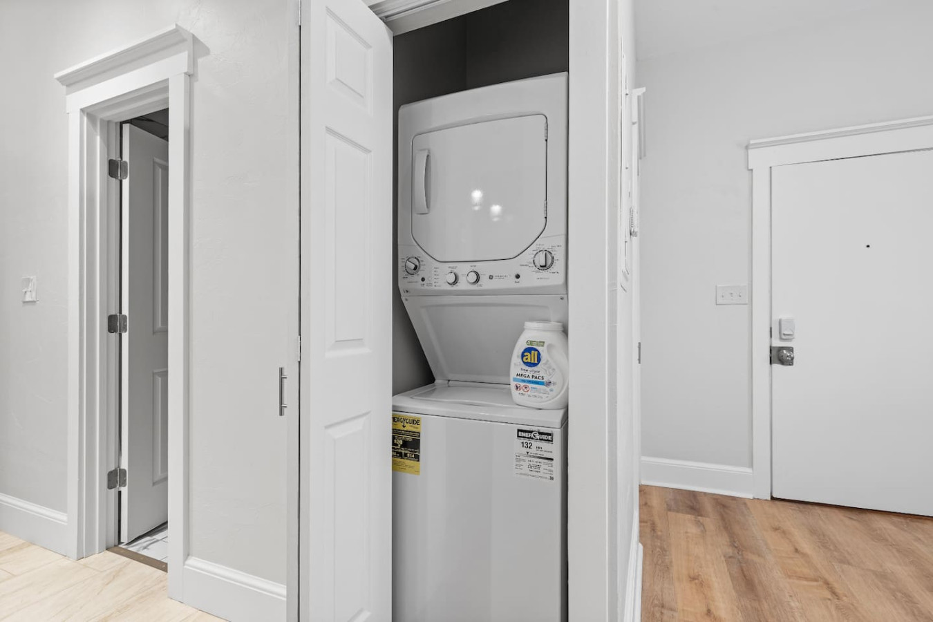 Laundry room with a washer, dryer, and folding area, offering all the convenience you need for a comfortable extended stay.