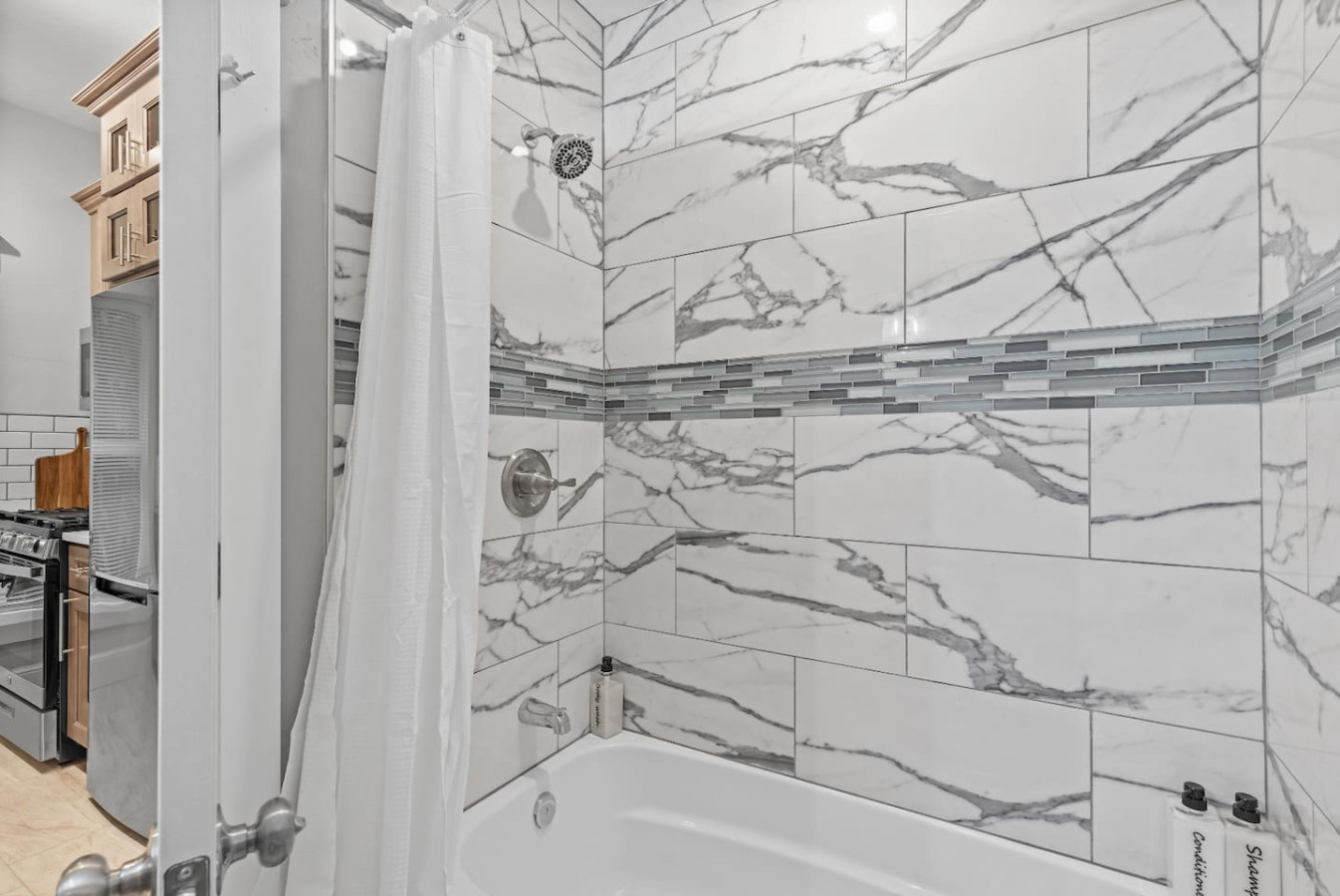 You feel a sense of calm as you enter the bathroom, where the thoughtful design and high-quality materials create a serene environment.
