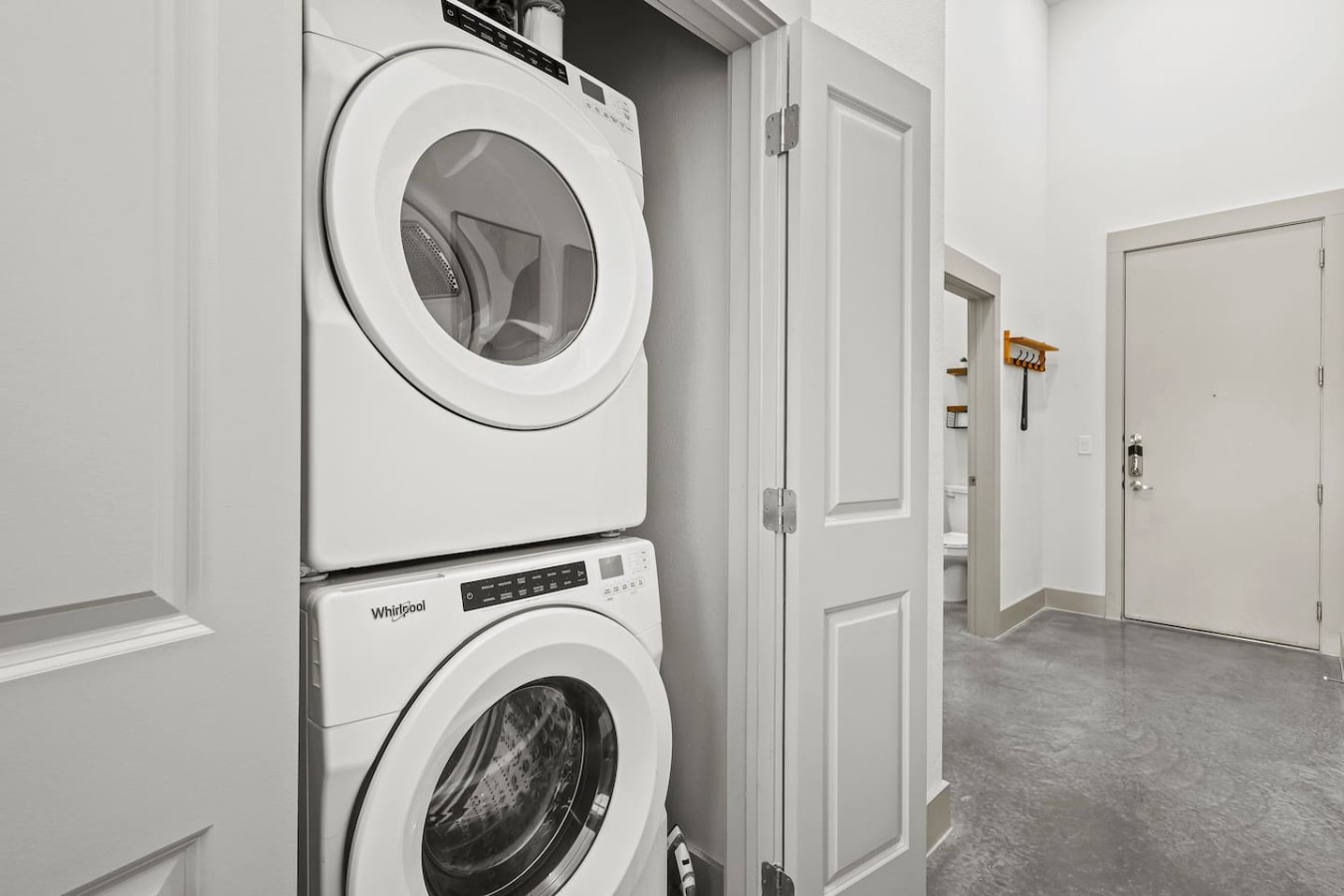 Convenient laundry room with washer, dryer, and all necessary supplies, making it easy to take care of your laundry needs.