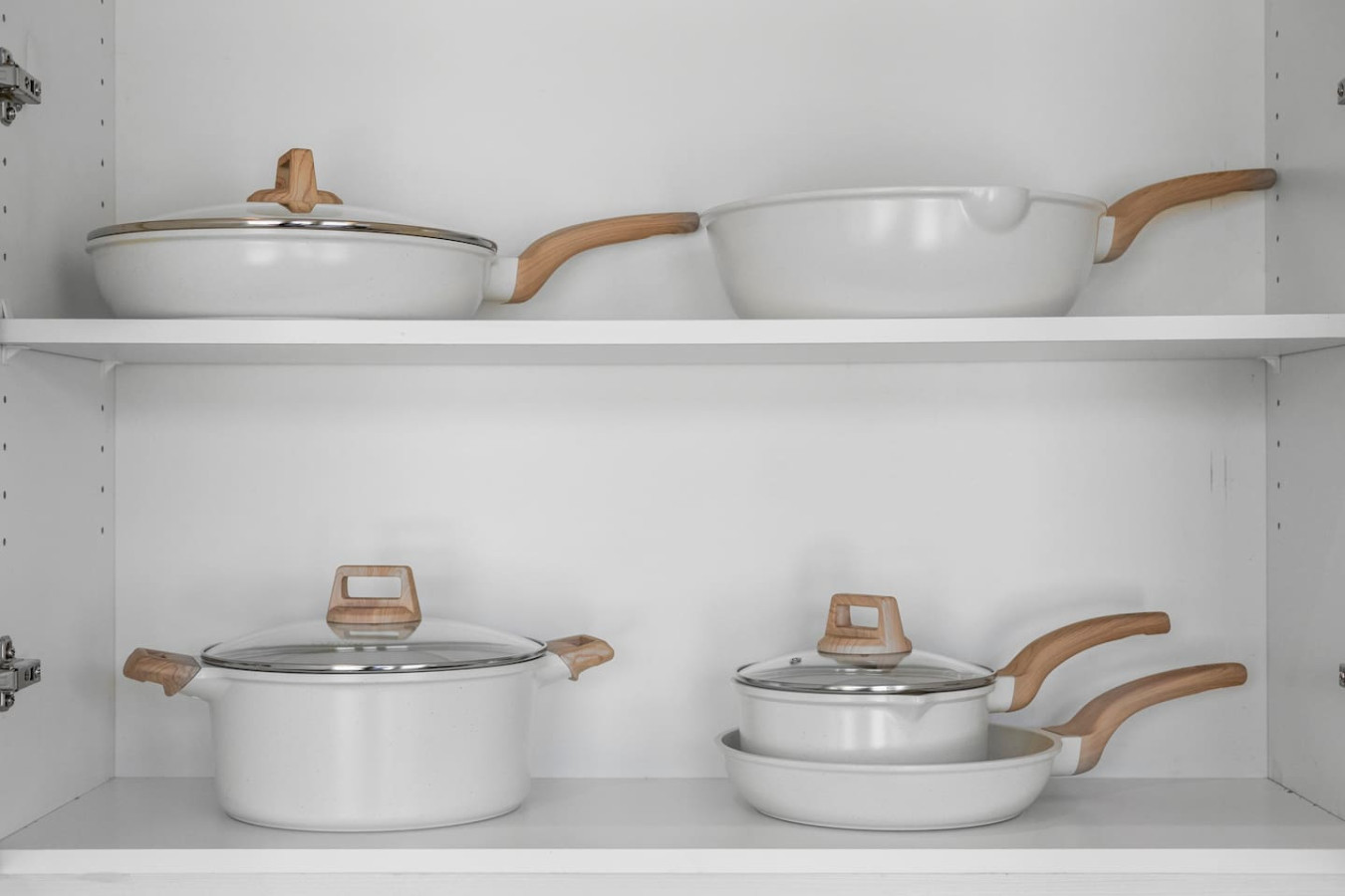 Kitchen cabinets stocked with cooking wares, glassware and silverwares, ideal for mixing up your favorite meals and drinks during your stay.
