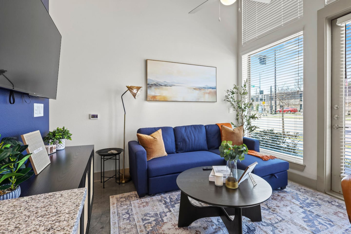 You feel a sense of peace as you step into the living room , with its inviting decor and soothing tones.
