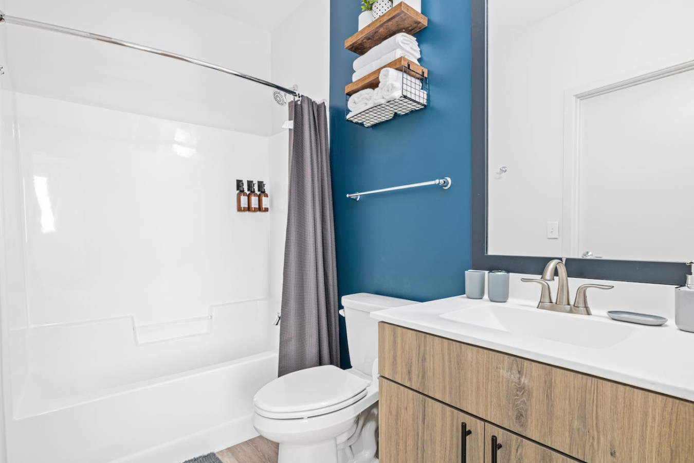 You feel a sense of calm as you enter the bathroom, where the thoughtful design and high-quality materials create a serene environment.