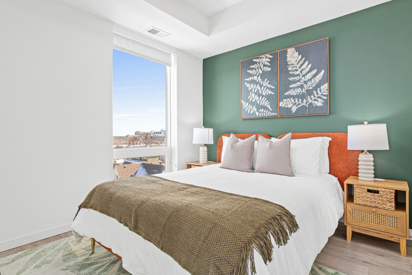 The bedroom’s serene ambiance invites you to relax, with a plush bed that promises a restful night's sleep.
