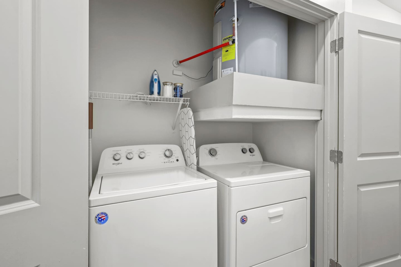 Convenient laundry room with washer, dryer, and all necessary supplies, making it easy to take care of your laundry needs.
