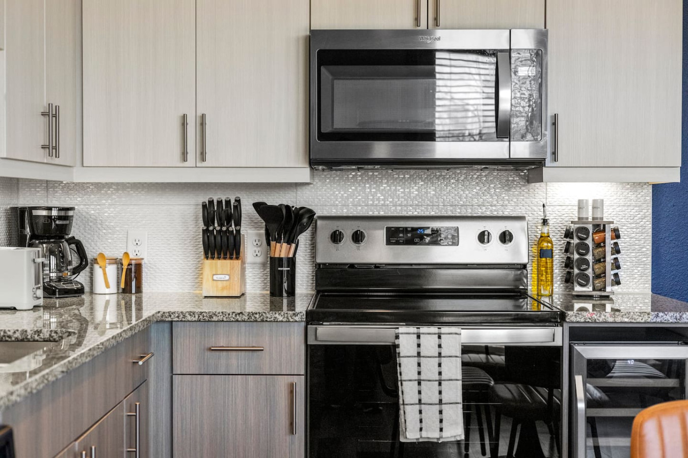 As you approach kitchen the elegant layout and well-stocked shelves make it the ideal spot to relax.