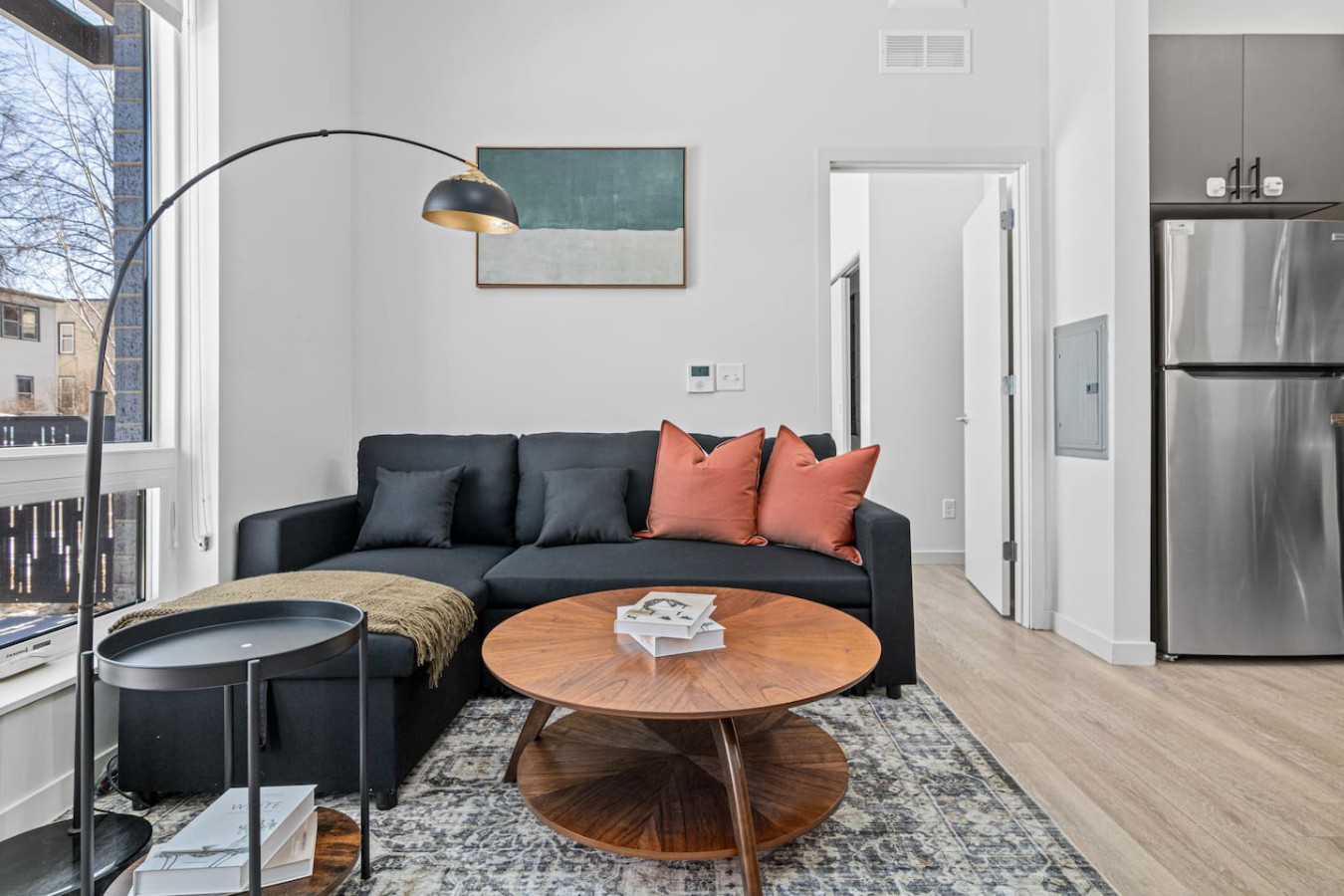 Relax in this warm, inviting space with wooden accents and cozy furnishings. You’ll love unwinding on the plush sofa, enjoying a good book or streaming your favorite shows in a serene atmosphere