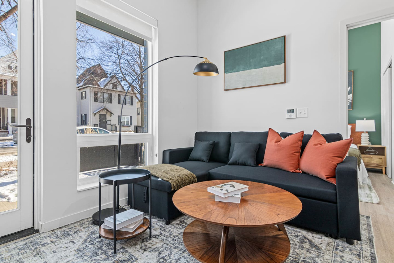 Relax in this warm, inviting space with wooden accents and cozy furnishings. You’ll love unwinding on the plush sofa, enjoying a good book or streaming your favorite shows in a serene atmosphere
