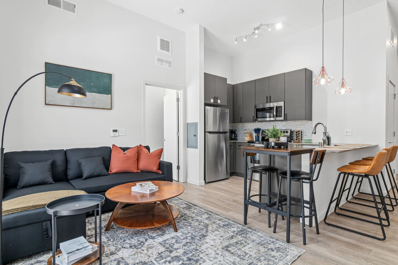 You feel a sense of peace as you step into the living room , with its inviting decor and soothing tones.