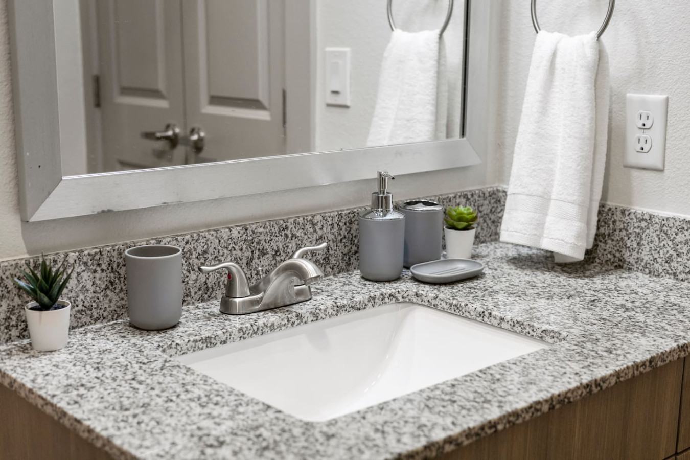 You feel a sense of calm as you enter the bathroom, where the thoughtful design and high-quality materials create a serene environment.