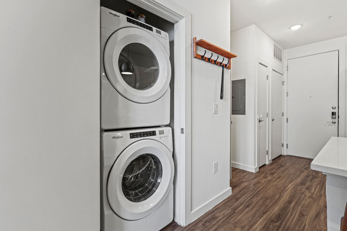 Convenient laundry room with washer, dryer, and all necessary supplies, making it easy to take care of your laundry needs.