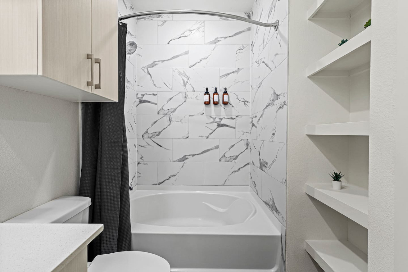 You feel a sense of calm as you enter the bathroom, where the thoughtful design and high-quality materials create a serene environment.