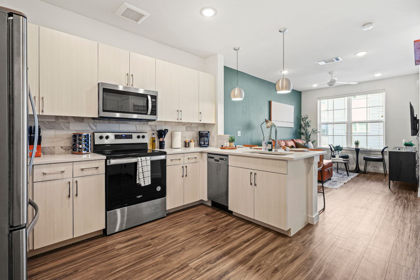 The kitchen’s open layout allows you to move freely as you prepare meals, with everything you need at your fingertips.