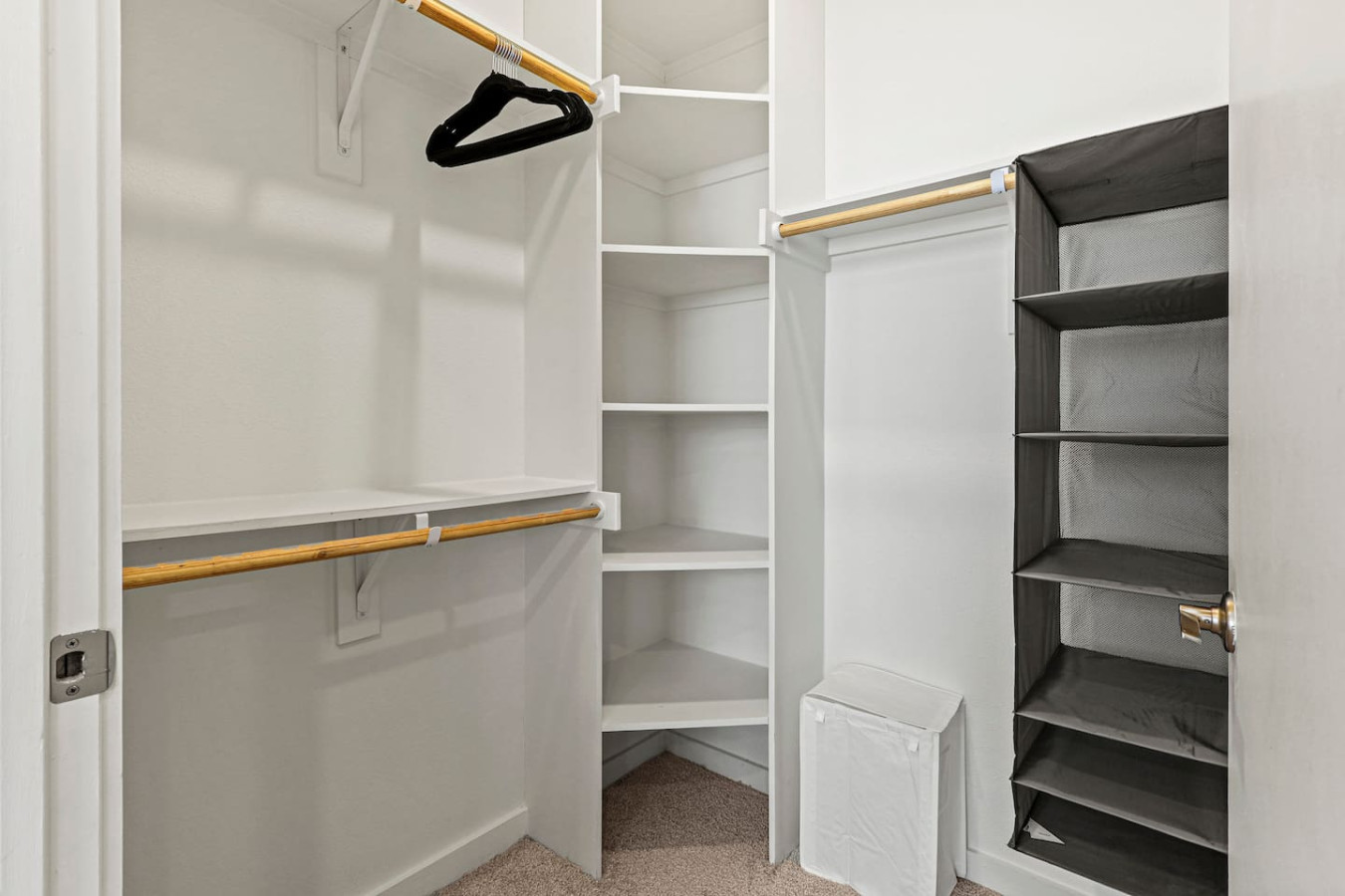 Modern built-in closets with hangers and shelving, perfect for keeping your clothes organized during your stay.