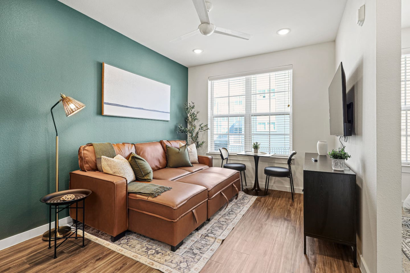 The living room is filled with natural light, creating a bright and welcoming space that invites relaxation.