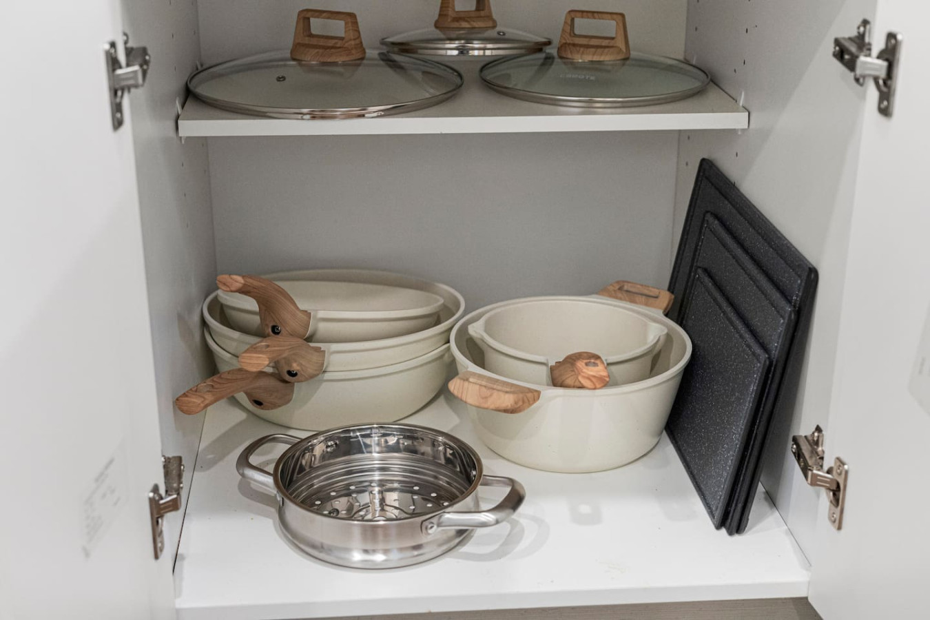 Kitchen cabinets stocked with cooking wares, glassware and silverwares, ideal for mixing up your favorite meals and drinks during your stay.