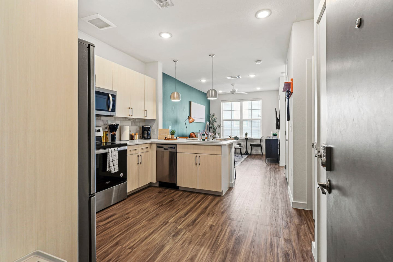 The kitchen’s open layout allows you to move freely as you prepare meals, with everything you need at your fingertips.