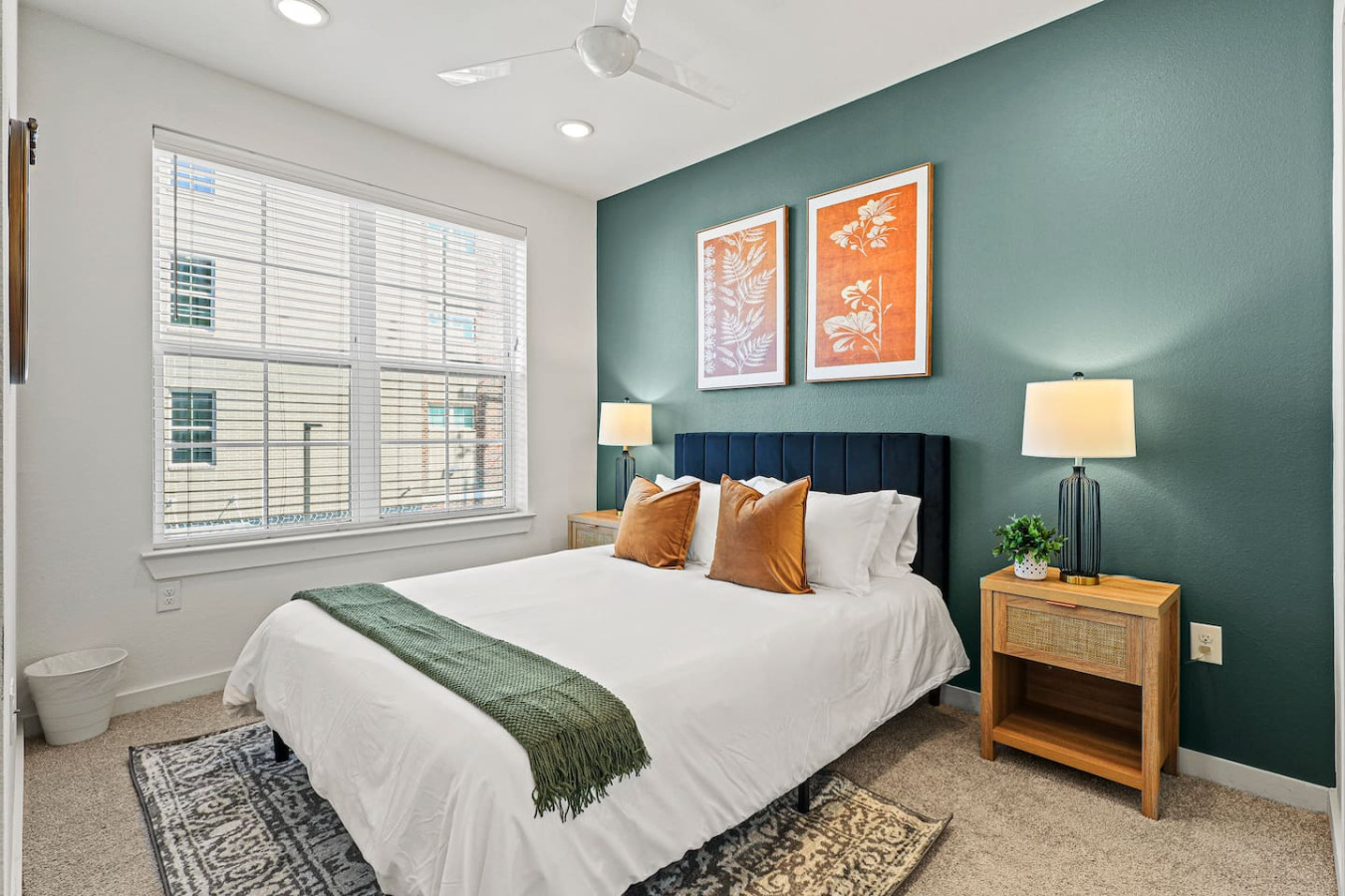 You feel enveloped in comfort as you relax on the queen bed, surrounded by a room designed for tranquility.