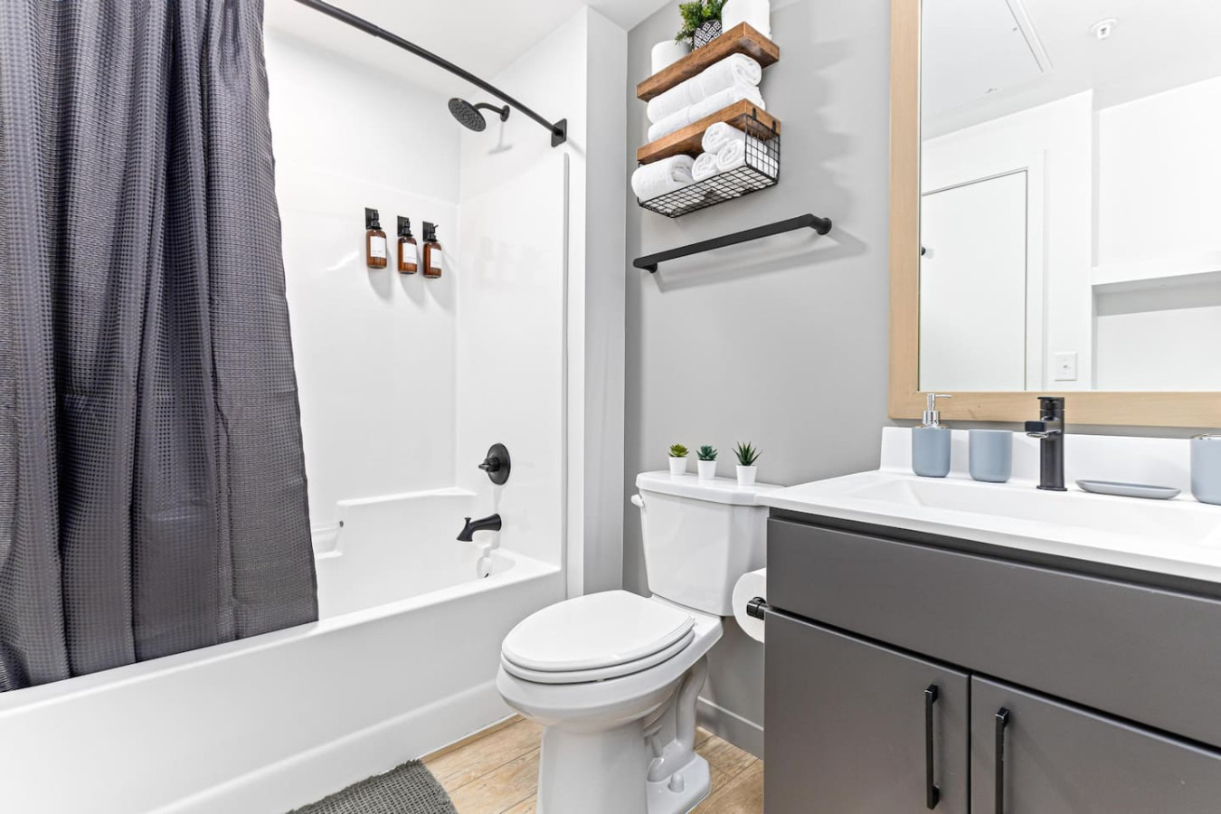 You feel a sense of calm as you enter the bathroom, where the thoughtful design and high-quality materials create a serene environment.