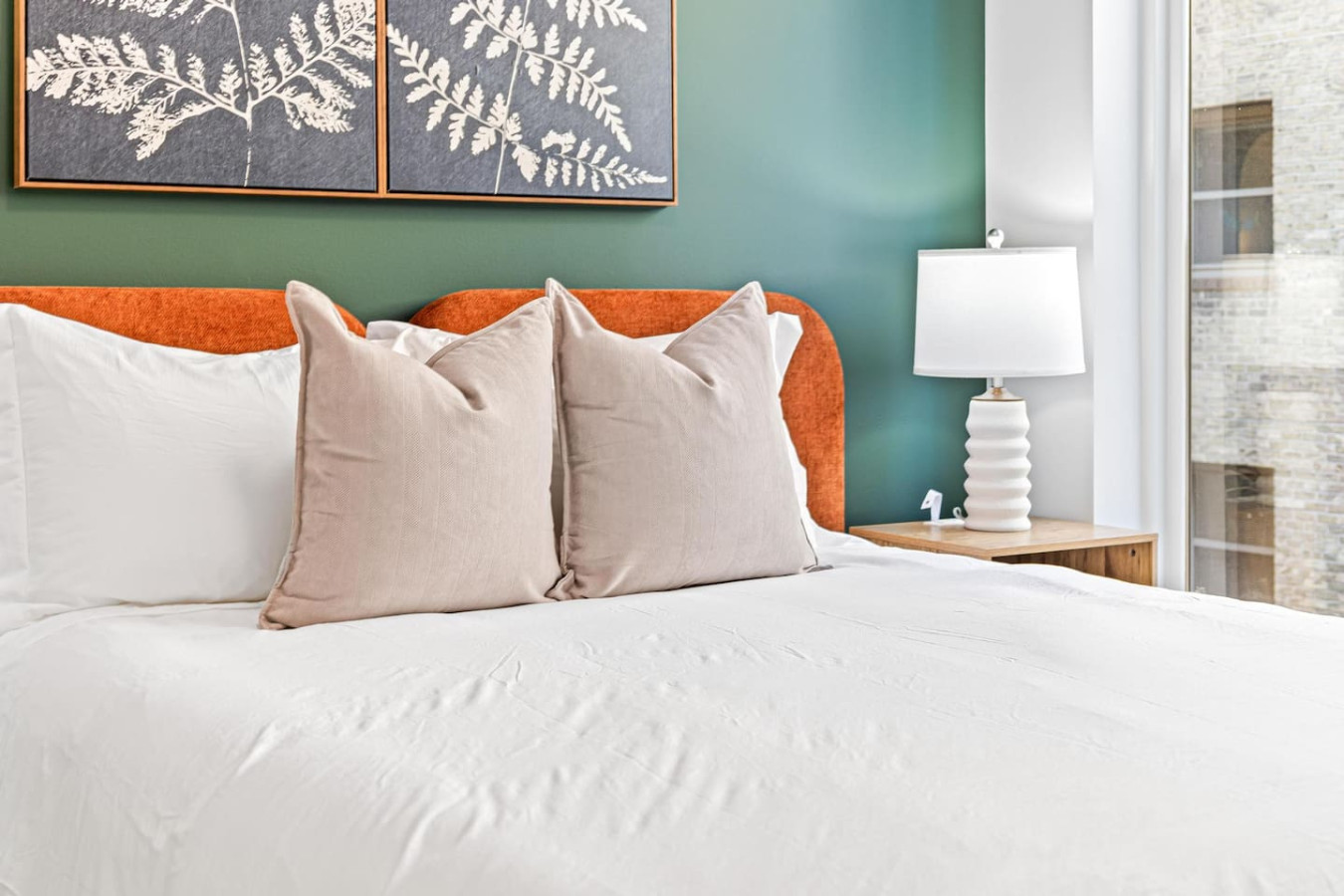 You feel enveloped in comfort as you relax on the queen bed, surrounded by a room designed for tranquility.