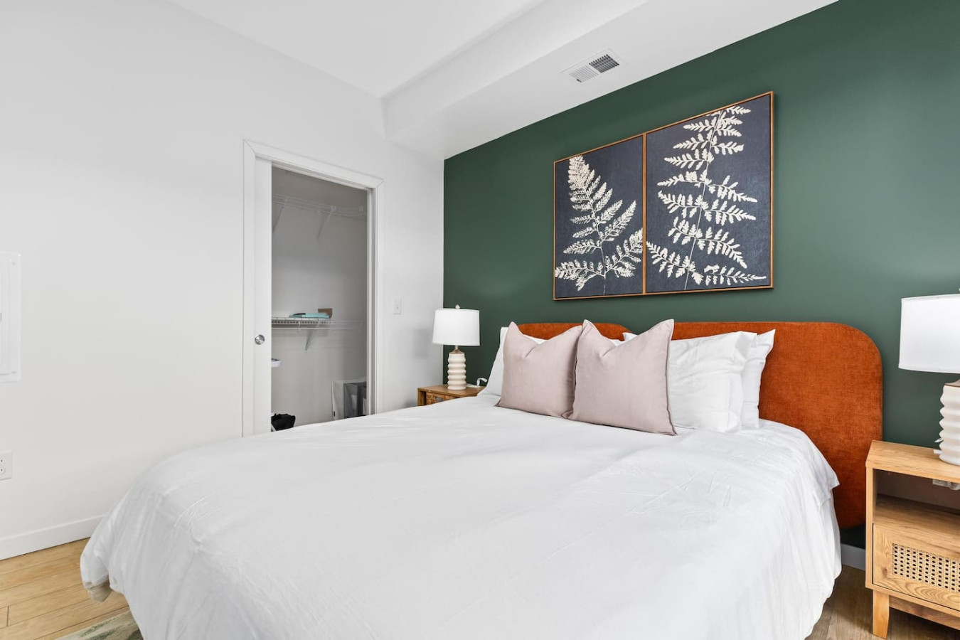 You feel enveloped in comfort as you relax on the queen bed, surrounded by a room designed for tranquility.