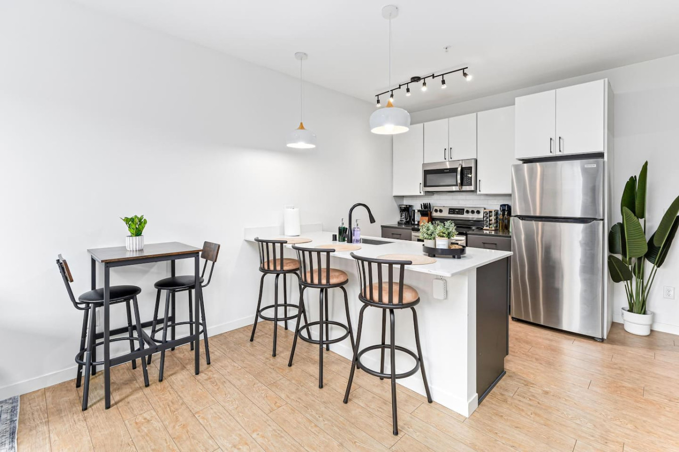As you approach the home bar, the elegant layout and well-stocked shelves make it the ideal spot to relax.