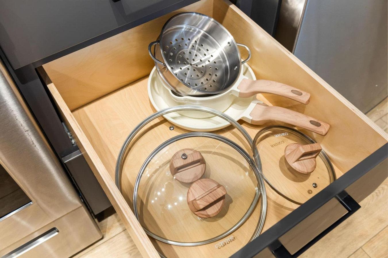 Kitchen cabinets stocked with cooking wares, glassware and silverwares, ideal for mixing up your favorite meals and drinks during your stay.