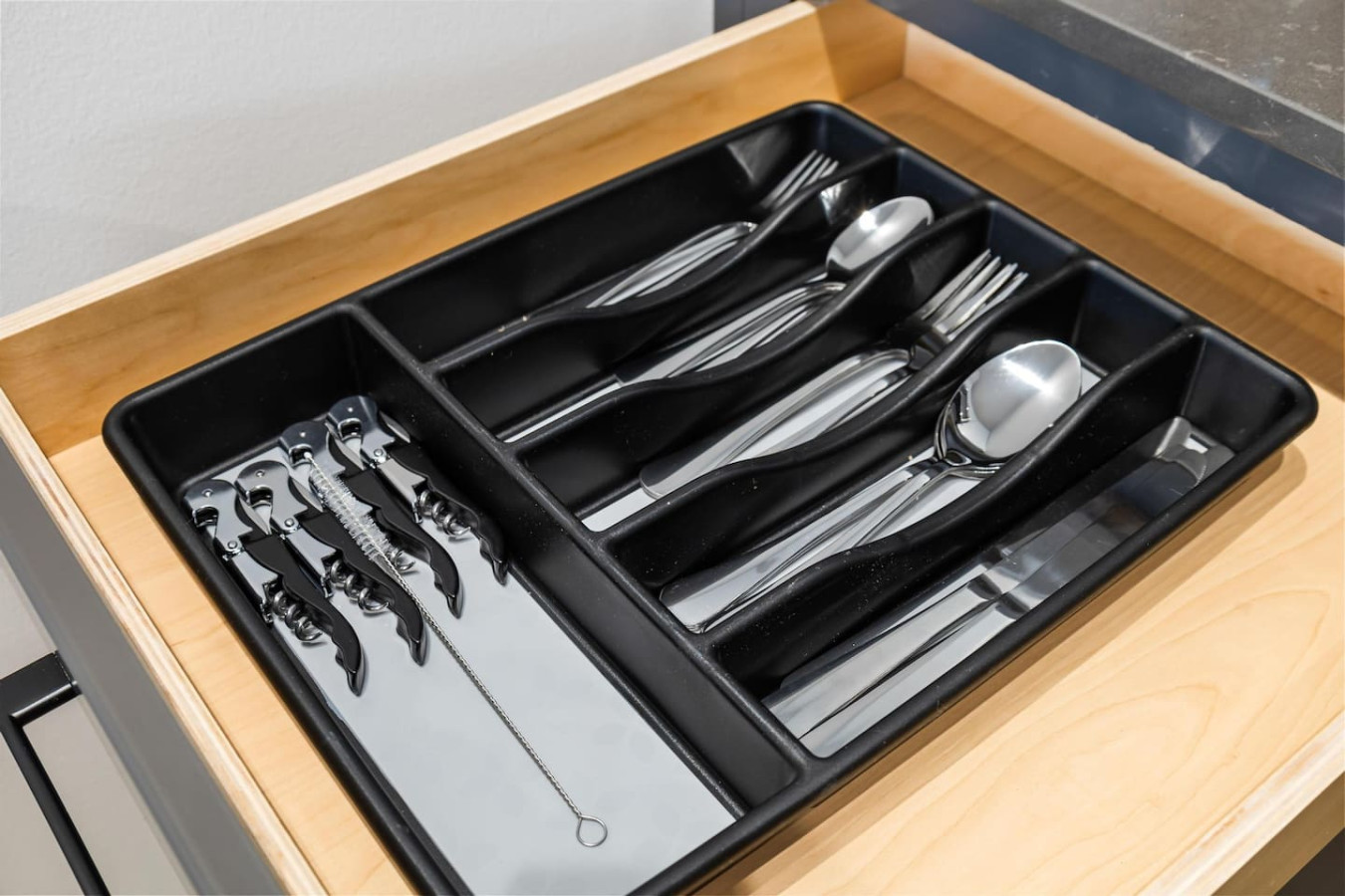 Kitchen utensils with scissors, measuring cups, grater, wine opener, can opener