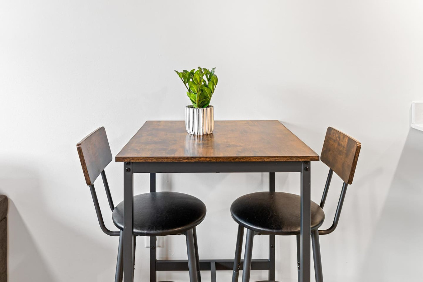 As you take your seat, the dining room's sophisticated design sets the stage for memorable meals and conversations.