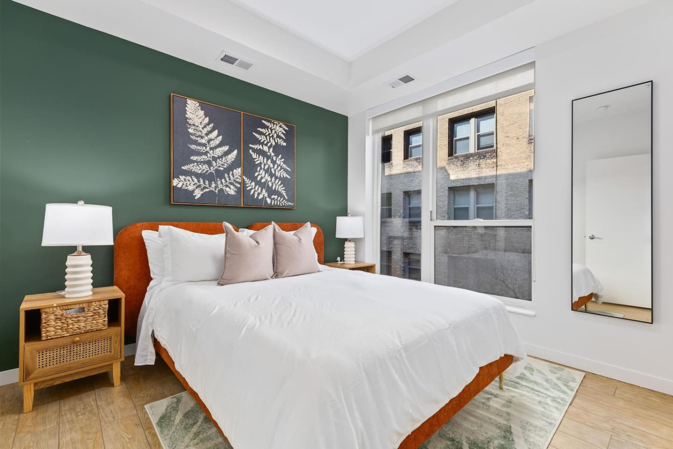 The bedroom’s serene ambiance invites you to relax, with a plush bed that promises a restful night's sleep.