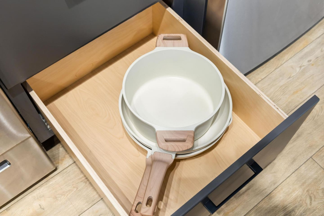 Kitchen cabinets stocked with cooking wares, glassware and silverwares, ideal for mixing up your favorite meals and drinks during your stay.