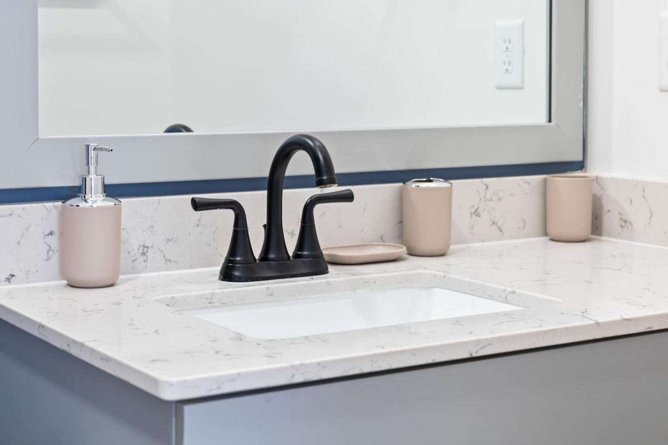 Immaculate bathroom featuring a spacious shower, fresh towels, and complimentary toiletries for a spa-like experience.