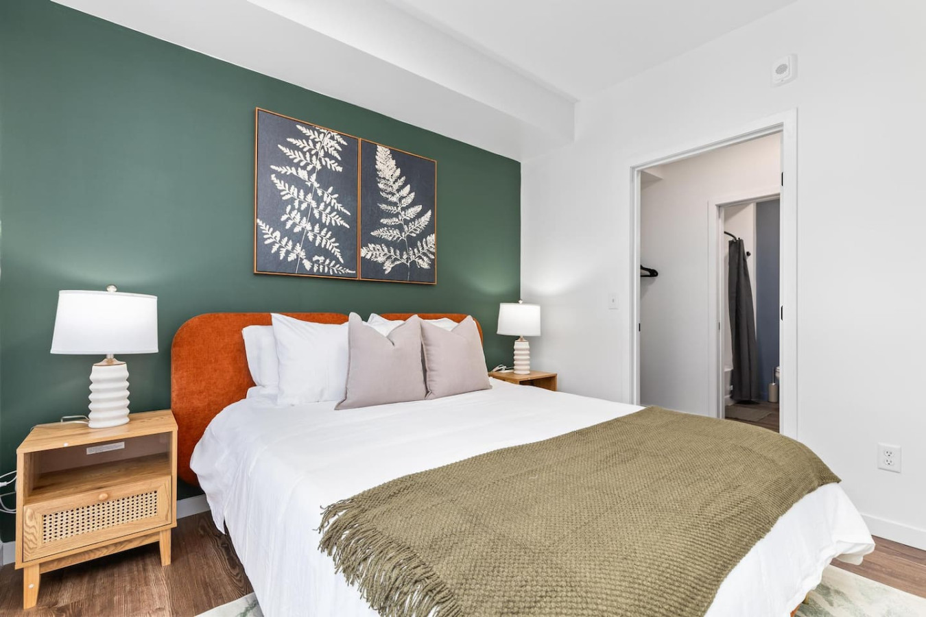 You feel enveloped in comfort as you relax on the queen bed, surrounded by a room designed for tranquility.