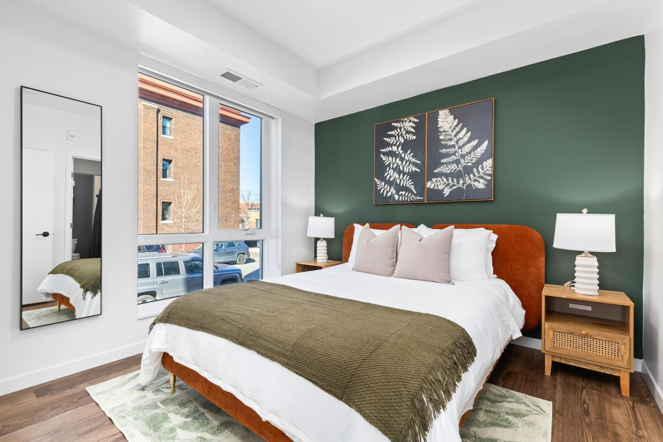 You feel enveloped in comfort as you relax on the queen bed, surrounded by a room designed for tranquility.