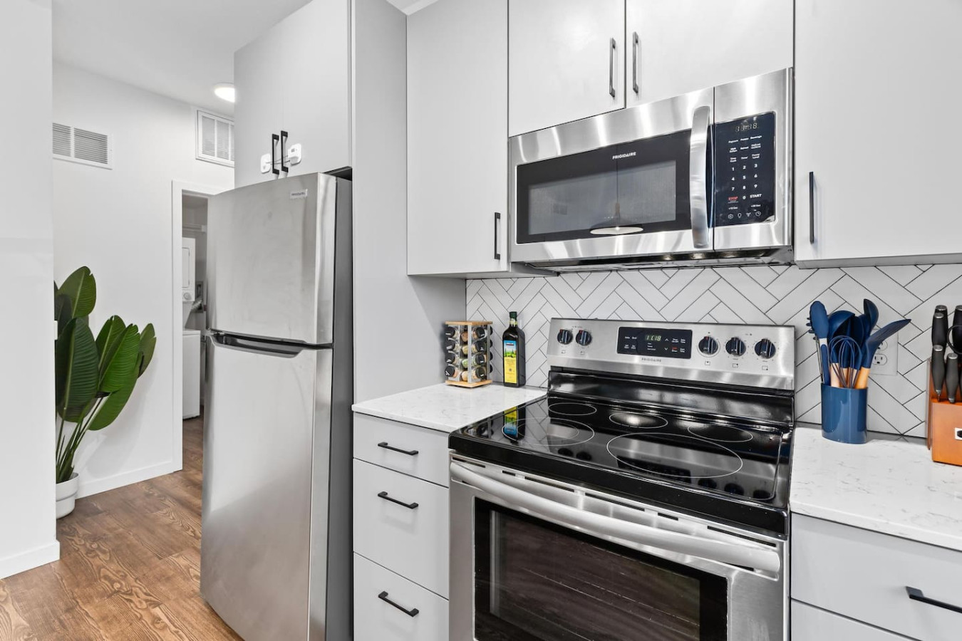 The kitchen’s open layout allows you to move freely as you prepare meals, with everything you need at your fingertips.