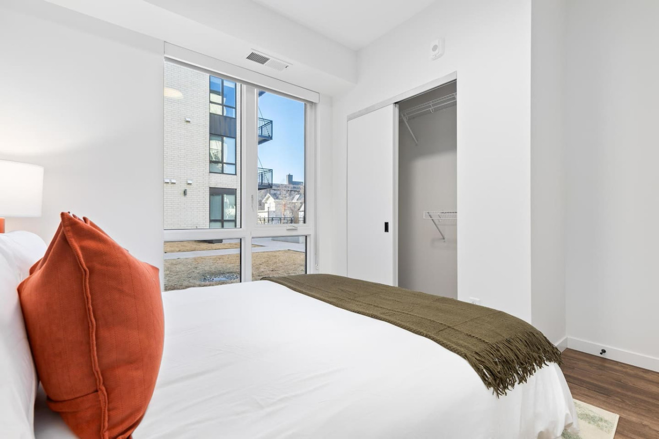 You feel enveloped in comfort as you relax on the queen bed, surrounded by a room designed for tranquility.