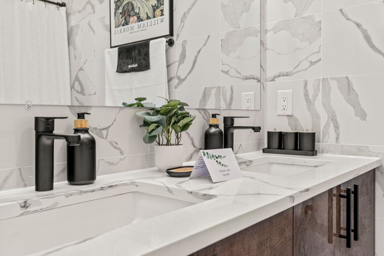 You feel a sense of calm as you enter the bathroom, where the thoughtful design and high-quality materials create a serene environment.