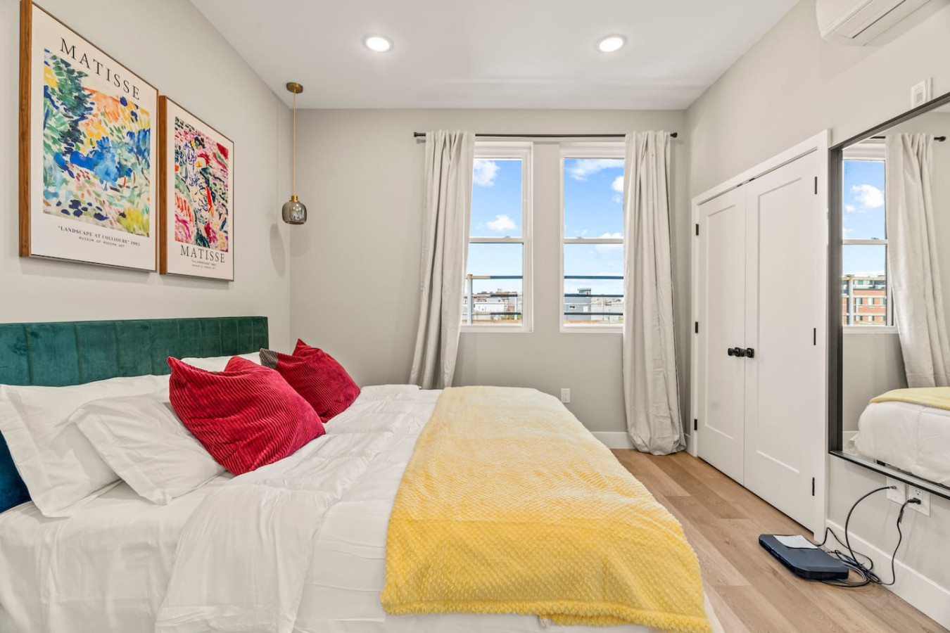 The bedroom’s serene ambiance invites you to relax, with a plush bed that promises a restful night's sleep.