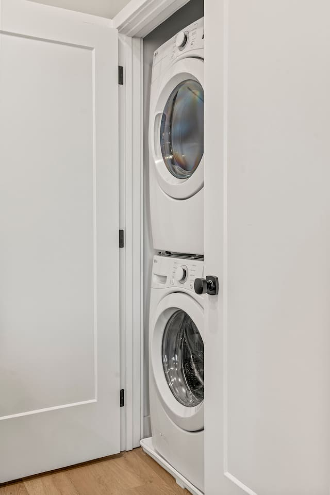 Laundry room with a washer, dryer, and folding area, offering all the convenience you need for a comfortable extended stay.