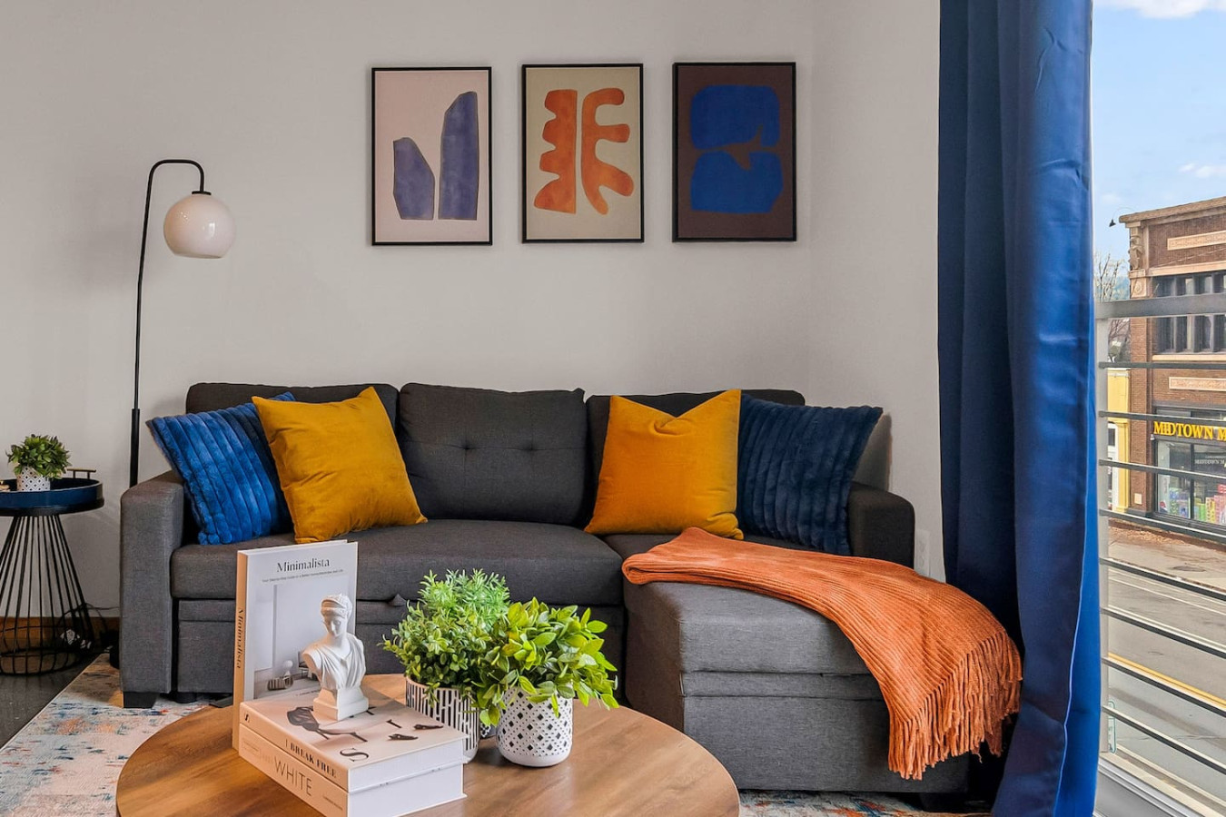 You feel a sense of peace as you step into the living room , with its inviting decor and soothing tones.