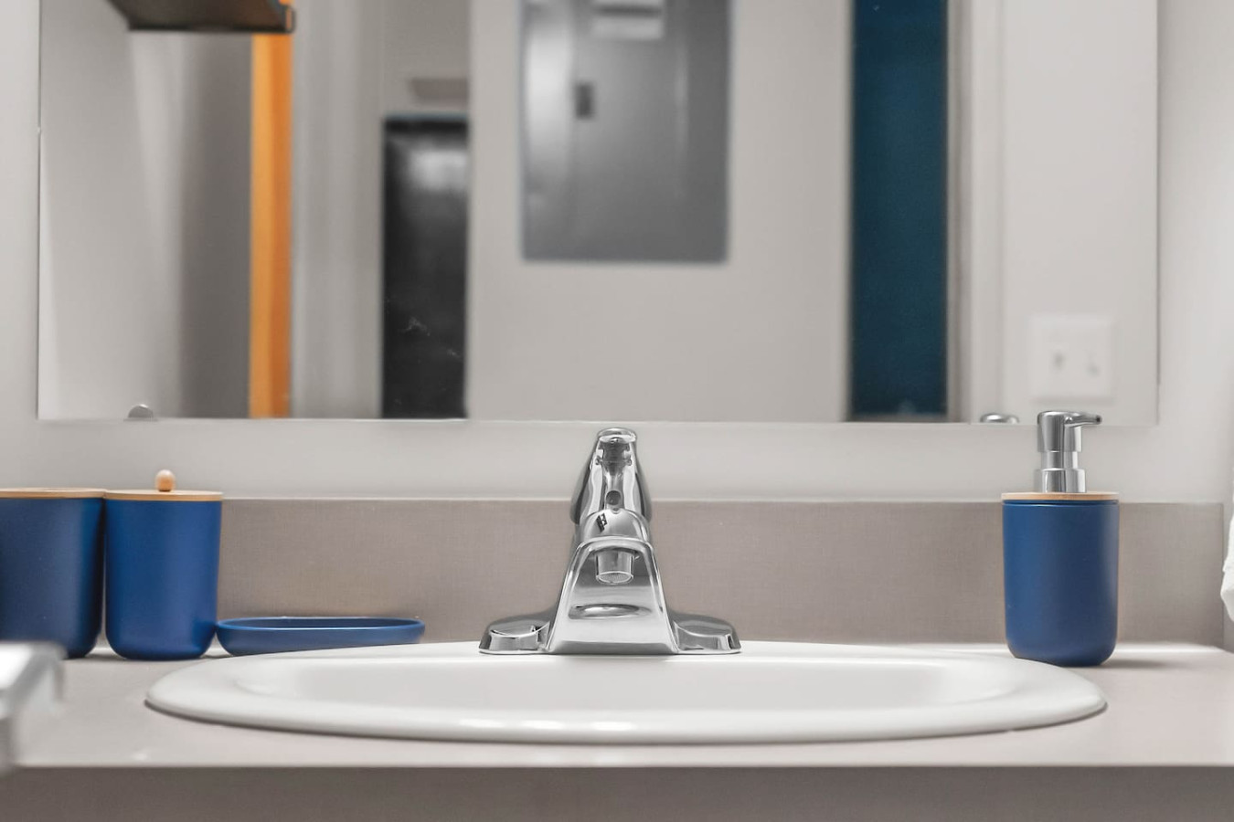Immaculate bathroom featuring a spacious shower, fresh towels, and complimentary toiletries for a spa-like experience.