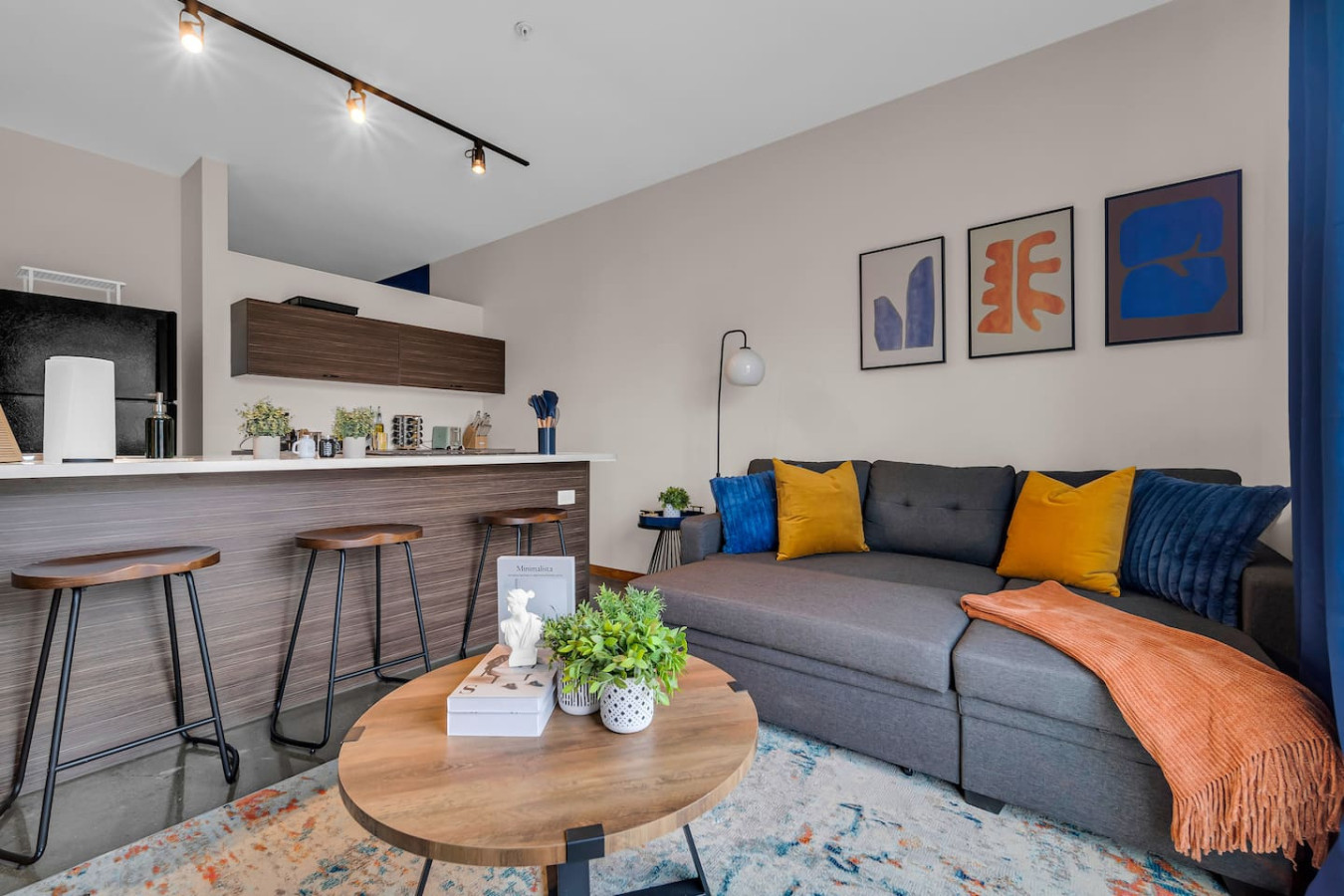 You feel at home as you settle into the living room, where the inviting atmosphere is perfect for lounging or entertaining.